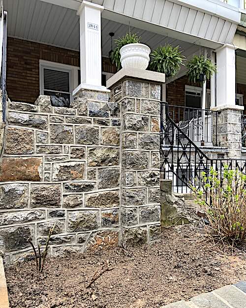 Picture of a stone wall on the front of a house
