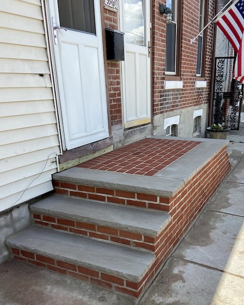 Picture of brick steps leading up to the front door of a house