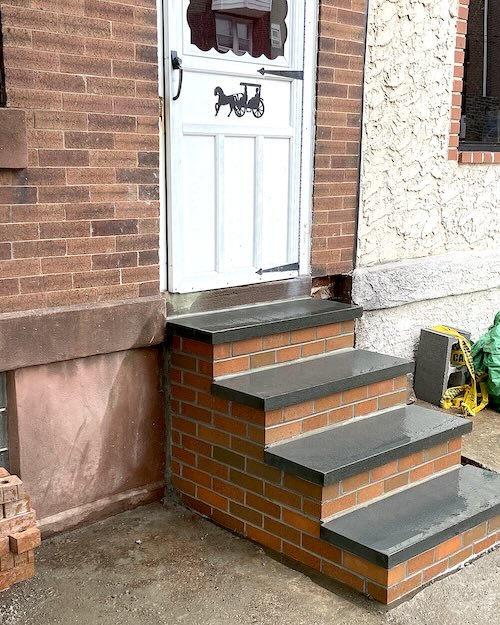 Picture of brick steps up to the front door of a house